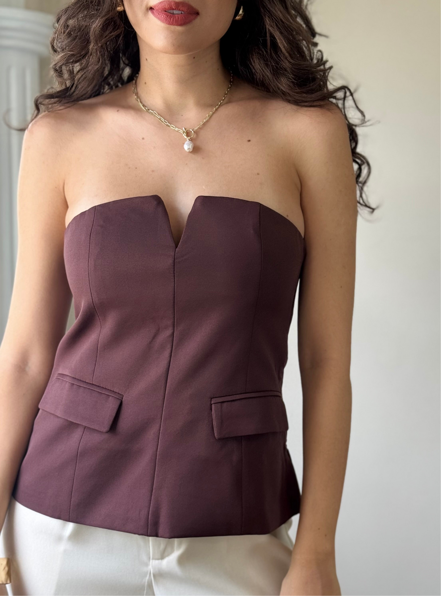 Blusa strapless con carteras
